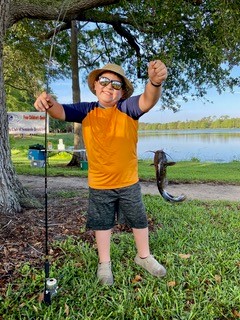 A proud fisherman with his big catch.