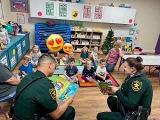 Our Sheriff Dept partners read to a preschool class