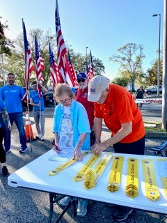 Sherri and Wayne handing out streamers!