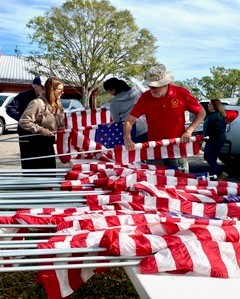 Volunteers prepare the flags!