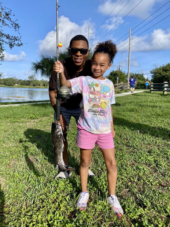 Showing off her great catfish catch!