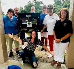 Kiwanians with newly installed library box at Little Lambs Christian Preschool.