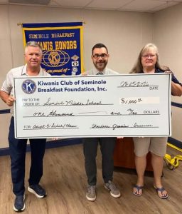 Club President Brett and Club Member Leda presenting a $1,000 donation from the Kiwanis Club of Seminole Breakfast Foundation to Dr. Robert Ovalle, Principal of Seminole Middle School.
