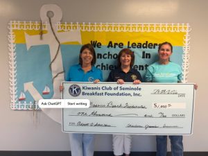 Charlene presenting a $1,000 Adopt-A-School donation to Madeira Beach Fundamental School.