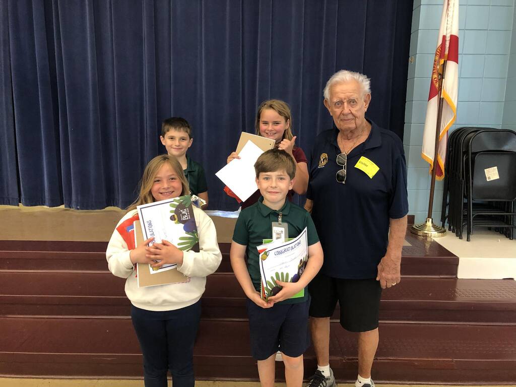 Bugs with Dale Club member Dale celebrates with Starkey Elementary students who participated in the Kiwanis BUGs (Bringing Up Grades) program.