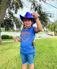 IMG_2656 A young angler proudly shows off her catch!