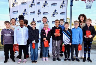 IMG_7865 Principal Kelly Kennedy (R) and Oakhurst Elementary students with their BUG awards.