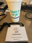 DCON 2023 - Joes Badge and Swag Cup.jpg